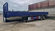 Полуприцеп с бортовой платформой AMUR LYR9500JSR 2-оси, г/п 50 тонн, с фитингами и кониками, новый